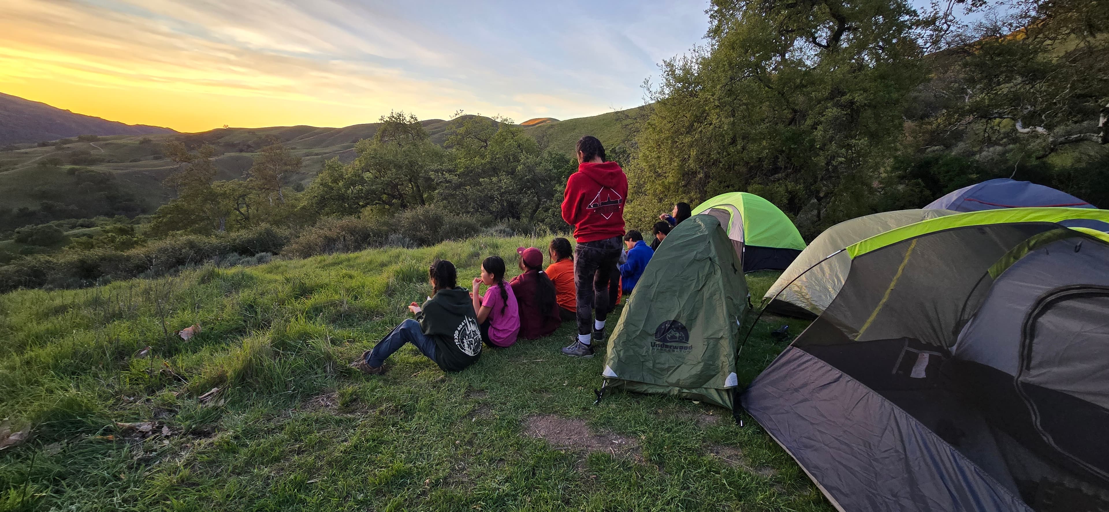 Scouts at camp during sunset