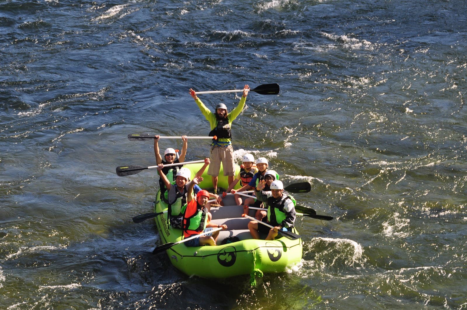 Scouts rafting together through fast water during a troop adventure